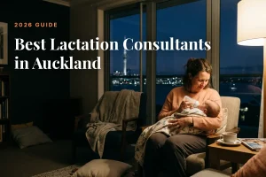Mother feeding her baby at home in Auckland at night, cover image for the Betteroo guide to the best lactation consultants in Auckland in 2026