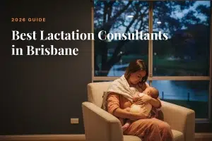 Mother feeding her baby at home in Brisbane at night, cover image for the Betteroo guide to the best lactation consultants in Brisbane in 2026