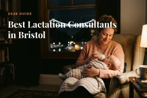Mother feeding her baby at home in the evening in Bristol, illustrating a guide to the best lactation consultants in Bristol