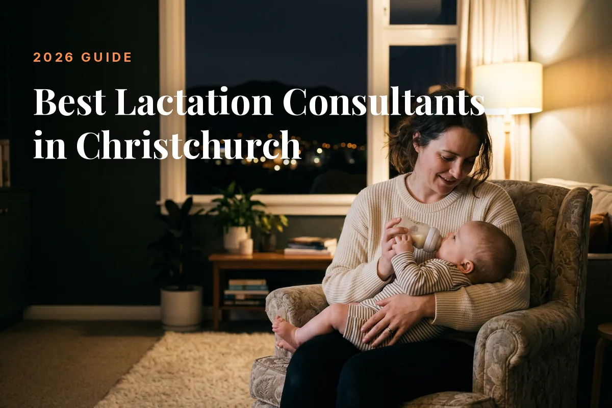 Mother feeding her baby at home in the evening in Christchurch, illustrating a guide to the best lactation consultants in Christchurch