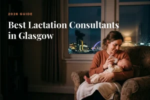 Mother feeding her baby at home in the evening in Glasgow, illustrating a guide to the best lactation consultants in Glasgow