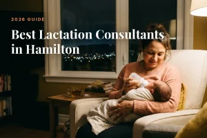 Mother feeding her baby at home in Hamilton at night, cover image for the Betteroo guide to the best lactation consultants in Hamilton in 2026