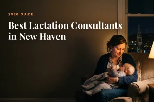Mother feeding her baby at home in New Haven at night, cover image for the Betteroo guide to the best lactation consultants in New Haven in 2026