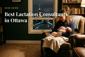 Mother feeding her baby at home in the evening in Ottawa, illustrating a guide to the best lactation consultants in Ottawa