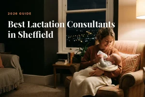 Mother feeding her baby at home in Sheffield at night, cover image for the Betteroo guide to the best lactation consultants in Sheffield in 2026