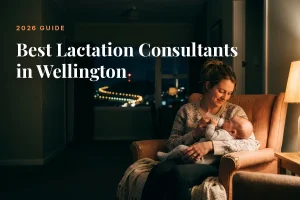 Mother feeding her baby at home in the evening in Wellington, illustrating a guide to the best lactation consultants in Wellington