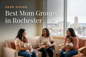 Best mom groups in Rochester, MN: three moms holding their babies at a Rochester new-parent meetup