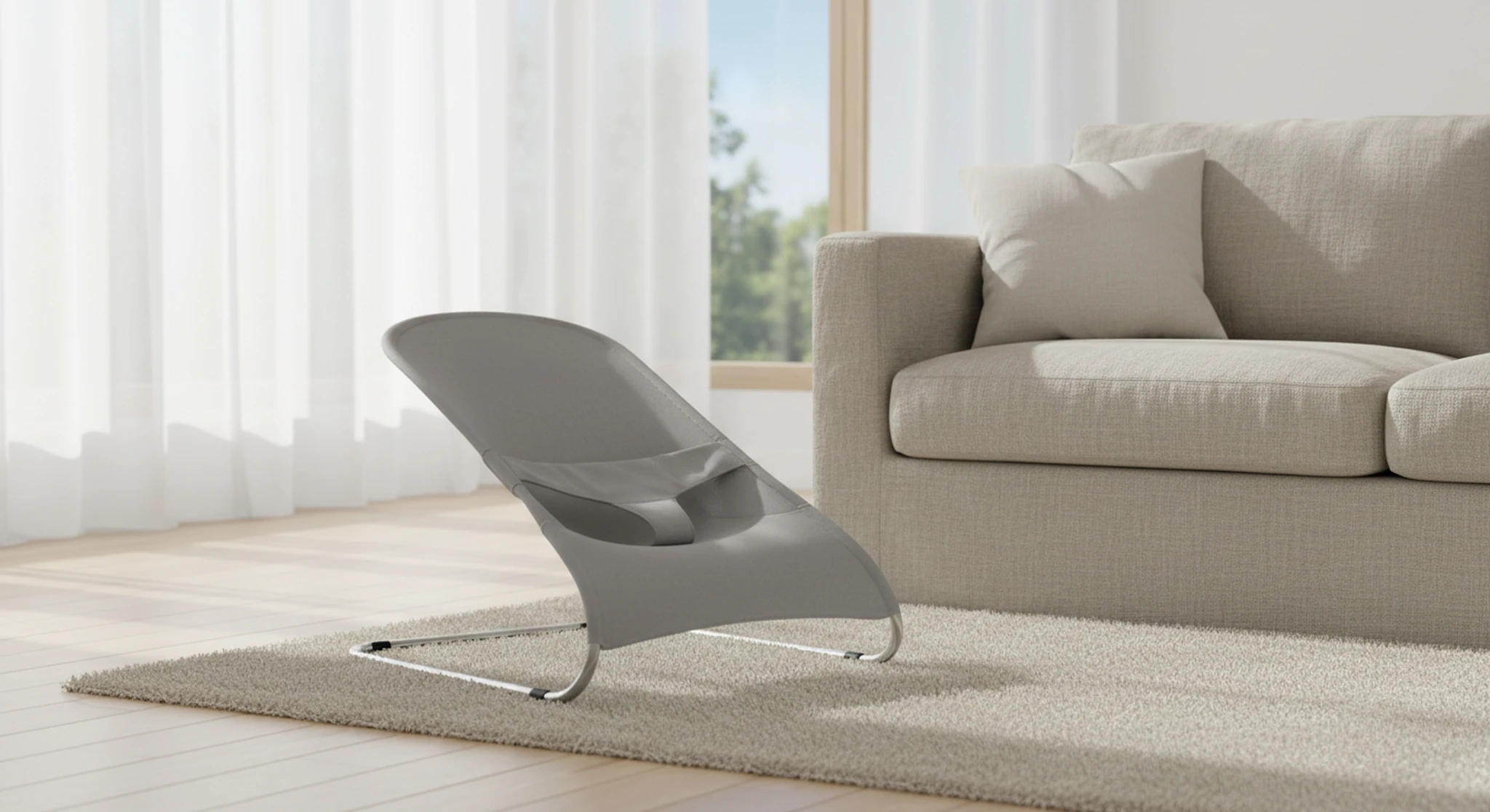 Contemporary living room with a gray lounge chair on a beige rug in front of a large window with sheer white curtains.