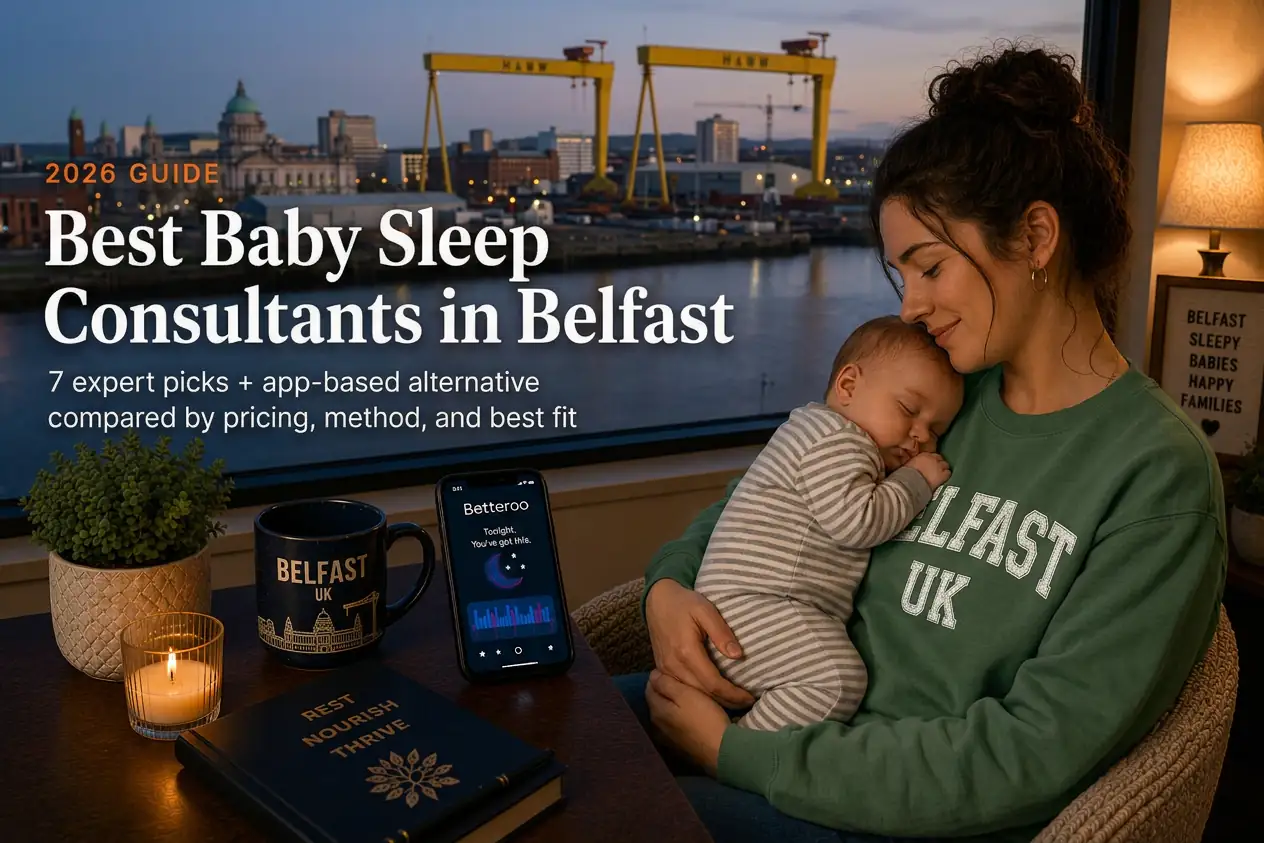 Mother rocking sleeping baby by window over Harland and Wolff cranes at dusk, baby sleep consultants in Belfast