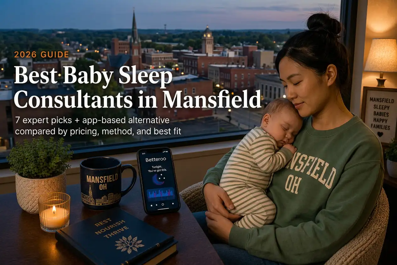Mother holding a baby by a window overlooking downtown Mansfield, Ohio at dusk, baby sleep consultants in Mansfield