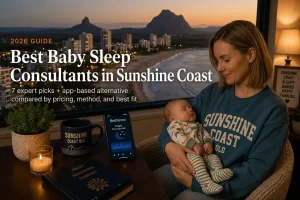 Top 7 Best Baby Sleep Consultants in Sunshine Coast Australia 2026 | Betteroo Mother rocking a sleeping baby above the beach and Glass House Mountains, baby sleep consultants in Sunshine Coast