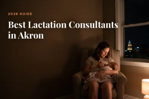 Mother feeding her baby at home in Akron at night, cover image for the Betteroo guide to the best lactation consultants in Akron in 2026