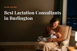 Mother feeding her baby at home in Burlington at night, cover image for the Betteroo guide to the best lactation consultants in Burlington in 2026