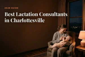 Mother feeding her baby at home in Charlottesville at night, cover image for the Betteroo guide to the best lactation consultants in Charlottesville in 2026