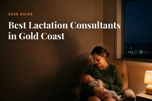 Mother feeding her baby at home in Gold Coast at night, cover image for the Betteroo guide to the best lactation consultants in Gold Coast in 2026