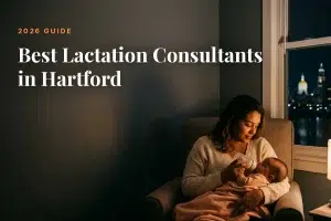 Mother feeding her baby at home in Hartford at night, cover image for the Betteroo guide to the best lactation consultants in Hartford in 2026