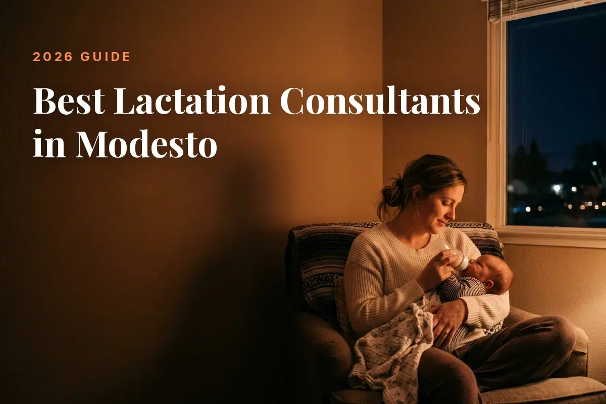Mother feeding her baby at home in Modesto at night, cover image for the Betteroo guide to the best lactation consultants in Modesto in 2026