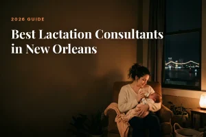 Mother feeding her baby at home in New Orleans at night, cover image for the Betteroo guide to the best lactation consultants in New Orleans in 2026