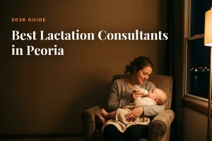 Mother feeding her baby at home in Peoria at night, cover image for the Betteroo guide to the best lactation consultants in Peoria in 2026