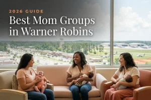 Best mom groups in Warner Robins, GA: three moms holding their babies at a Warner Robins new-parent meetup